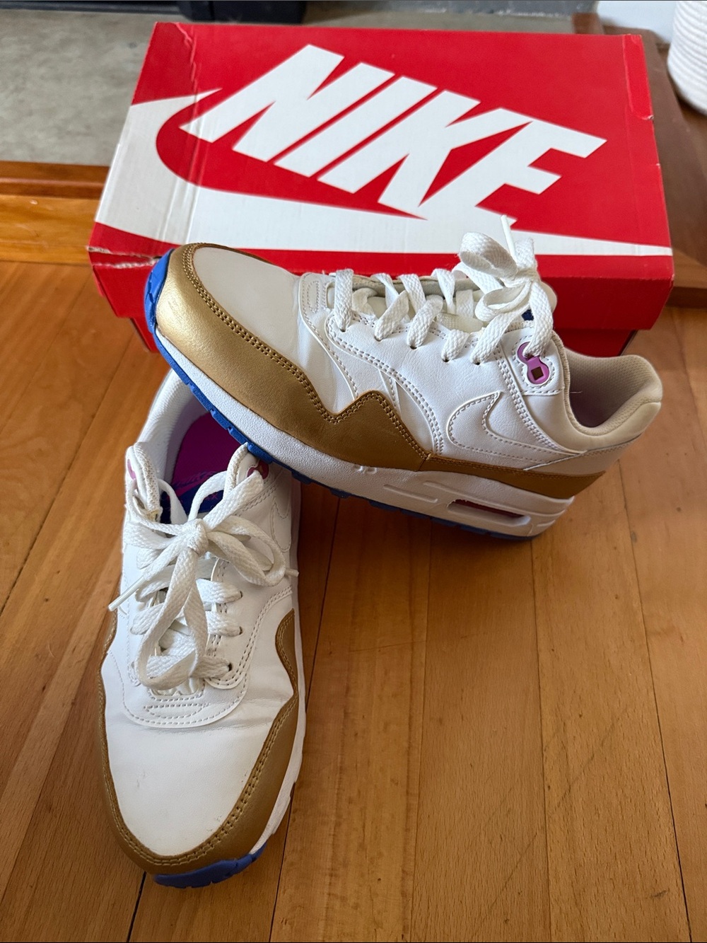 Nike Women White Gold Sneakers with Blue Outsole
